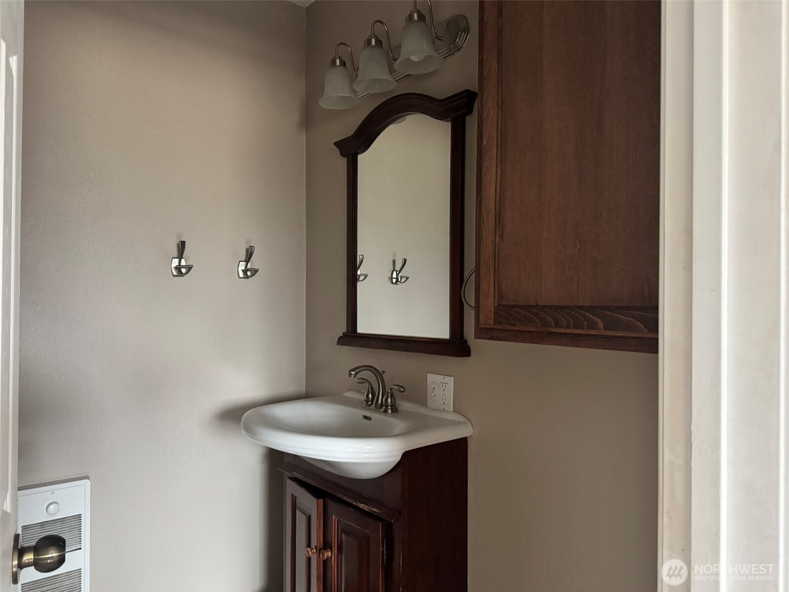 21 Orchard Loop North Tonasket, WA 98855 - Photo 19 of 23 a bathroom with a sink and a mirror