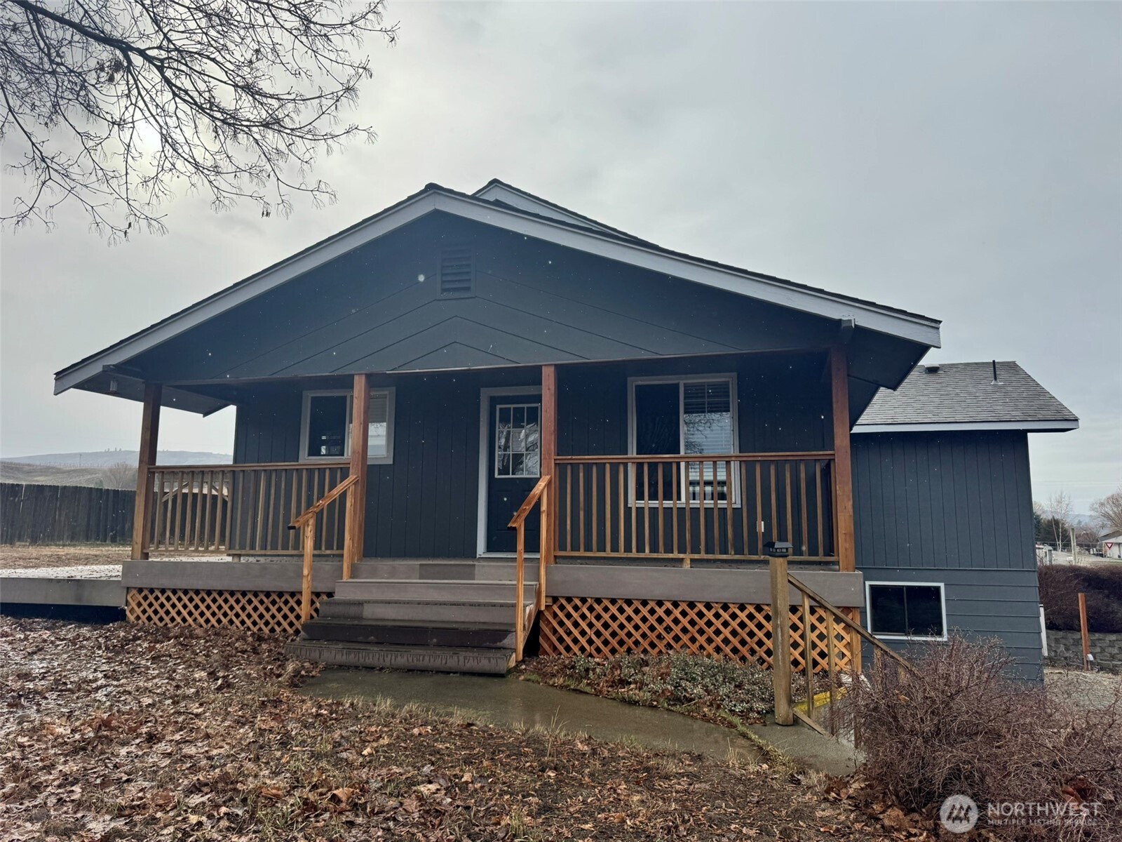 21 Orchard Loop North Tonasket, WA 98855 - Photo 2 of 23 a front view of a house with a garden