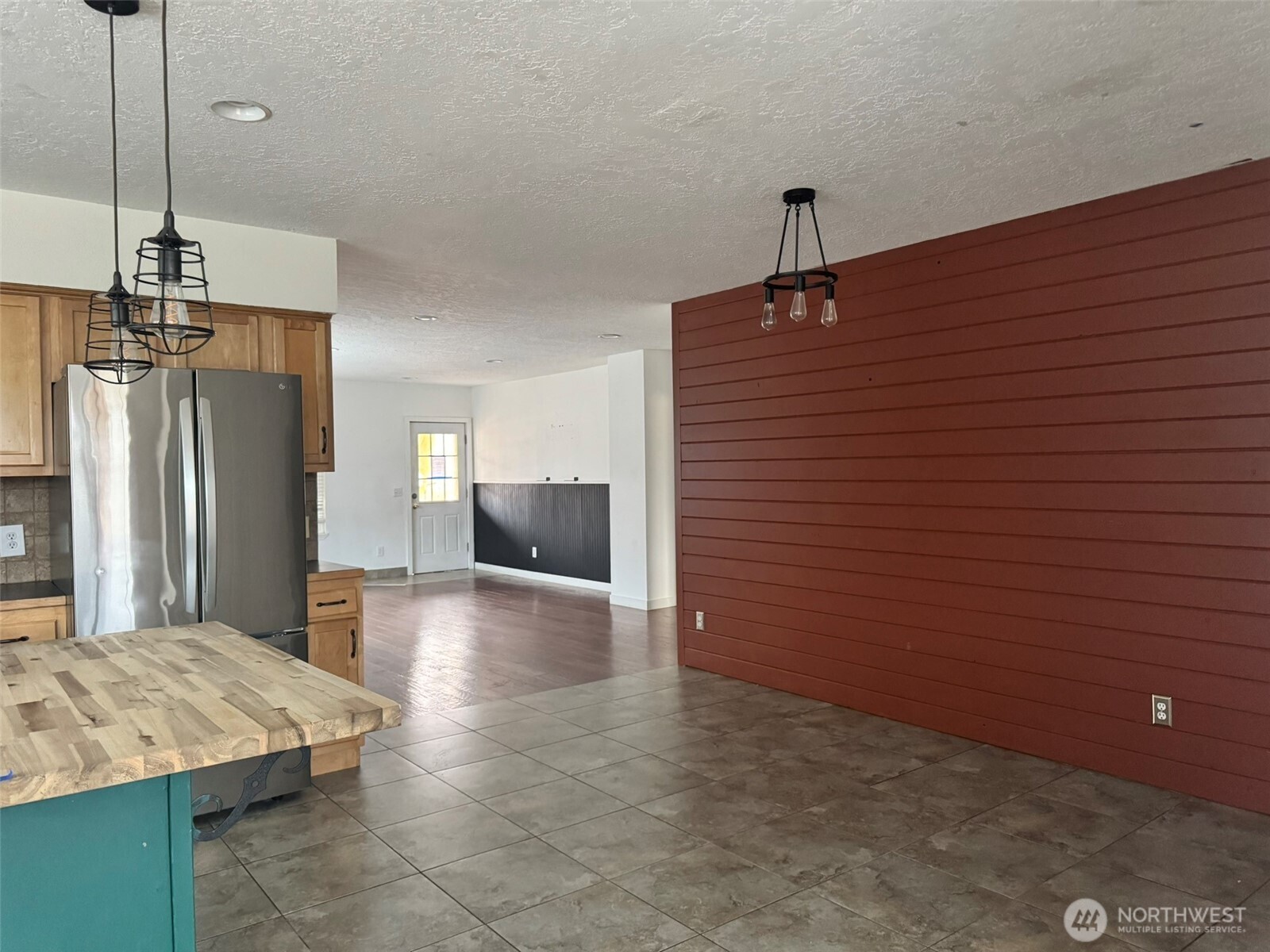 21 Orchard Loop North Tonasket, WA 98855 - Photo 8 of 23 a kitchen with kitchen island a sink stainless steel appliances and cabinets