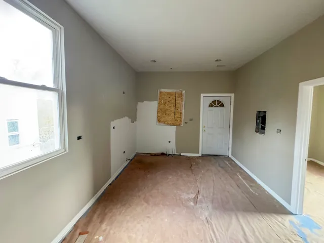 a view of empty room with windows