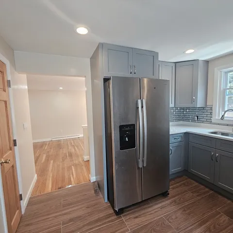 a kitchen with stainless steel appliances a refrigerator and a sink