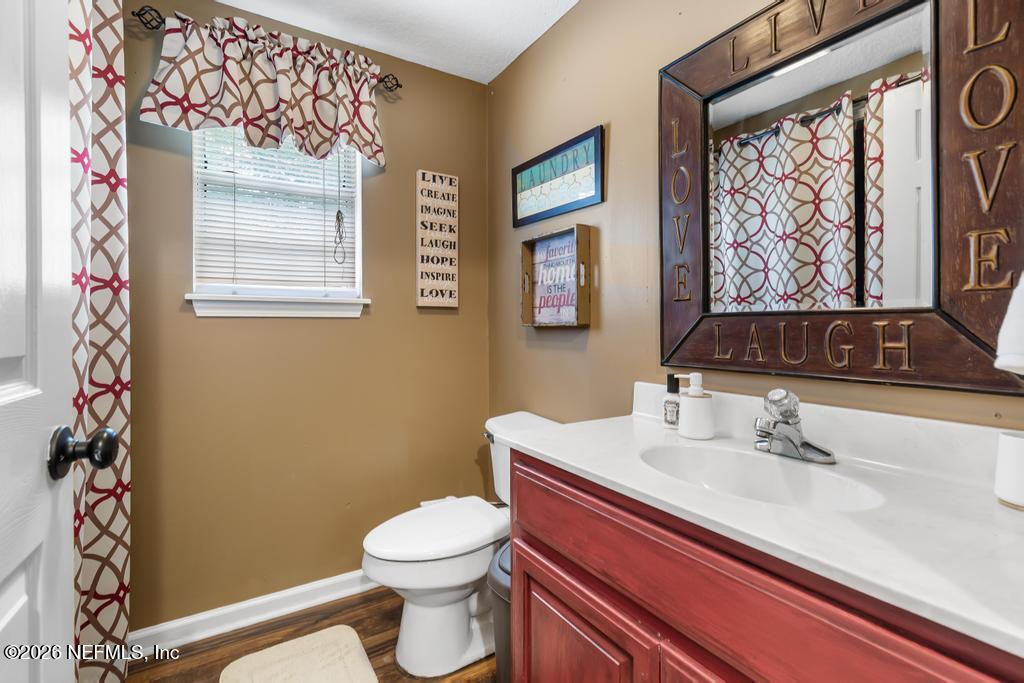 28317 Pike Road Hilliard, FL 32046 - Photo 14 of 42 a bathroom with a sink and a mirror
