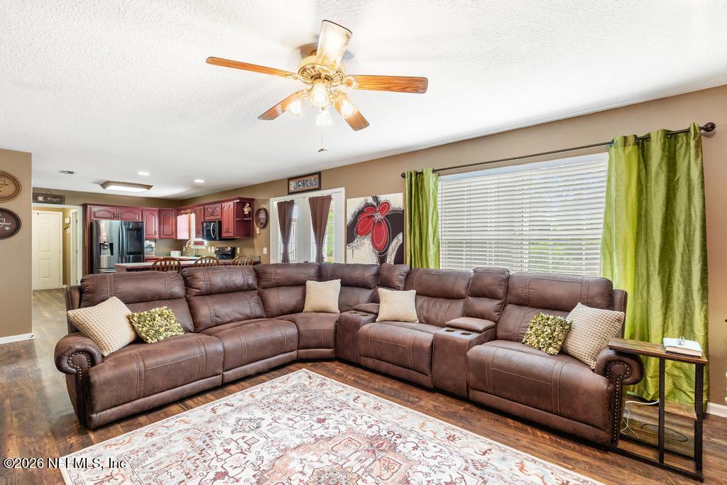 28317 Pike Road Hilliard, FL 32046 - Photo 21 of 42 a living room with furniture and a large window