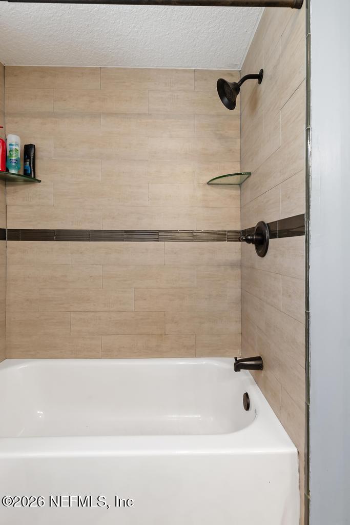 28317 Pike Road Hilliard, FL 32046 - Photo 29 of 42 a bathroom with a shower