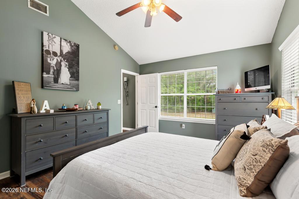 28317 Pike Road Hilliard, FL 32046 - Photo 32 of 42 a bedroom with a bed and a window