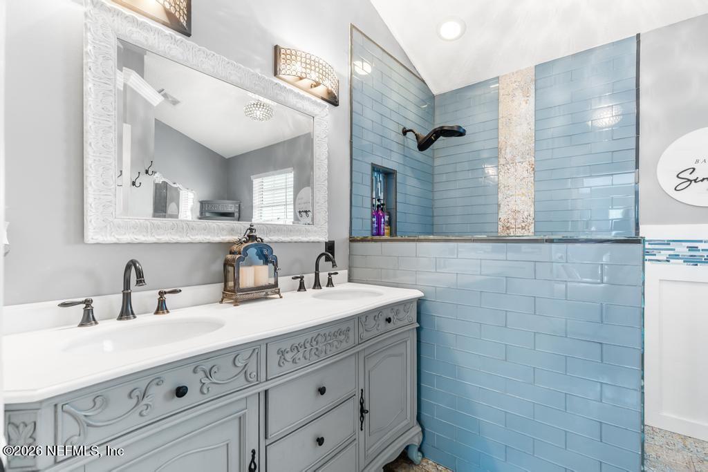 28317 Pike Road Hilliard, FL 32046 - Photo 33 of 42 a bathroom with a sink double vanity and a mirror
