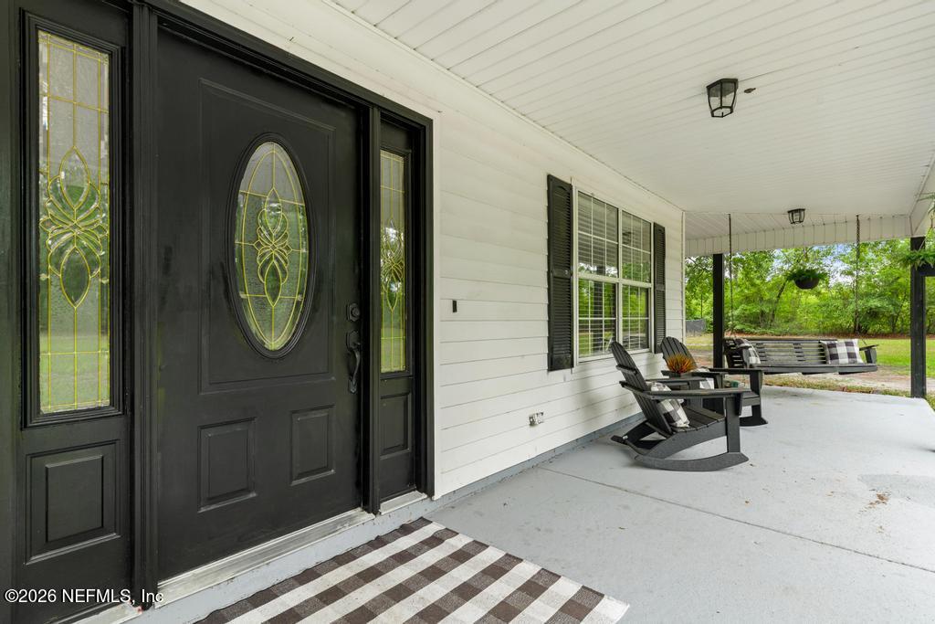 28317 Pike Road Hilliard, FL 32046 - Photo 4 of 42 a view of a two chair in the balcony