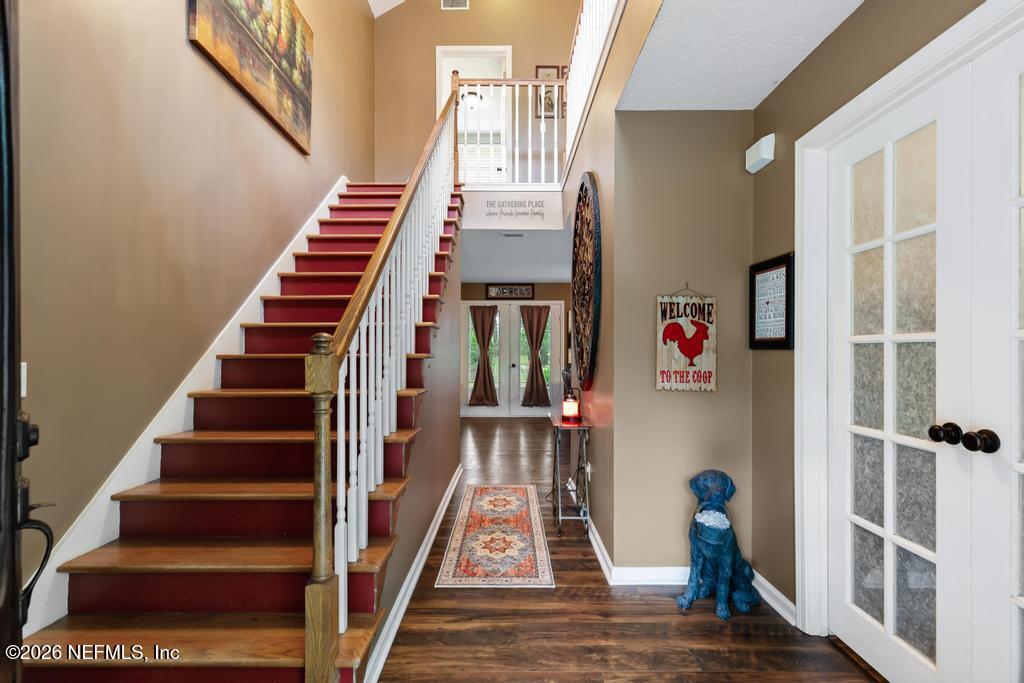 28317 Pike Road Hilliard, FL 32046 - Photo 5 of 42 a view of entryway with wooden floor and windows