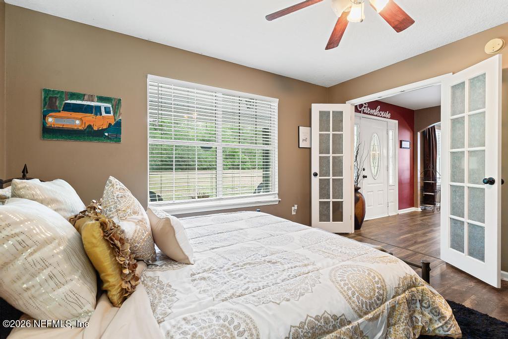 28317 Pike Road Hilliard, FL 32046 - Photo 9 of 42 a bed sitting in a bedroom next to a window