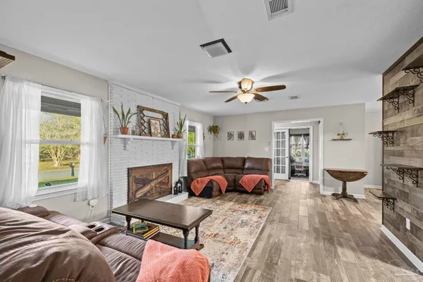 a living room with furniture a couch and a fireplace