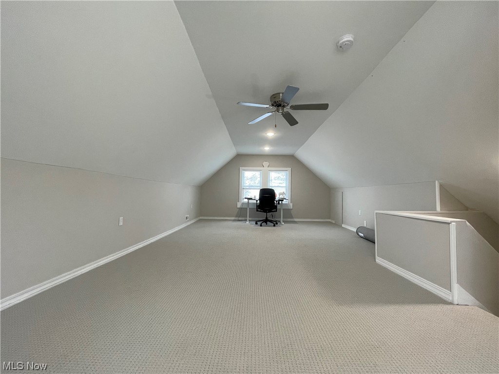 3294 East Overlook Road Cleveland Heights, OH 44118 - Photo 10 of 13 Additional living space with lofted ceiling, ceiling fan, and light colored carpet