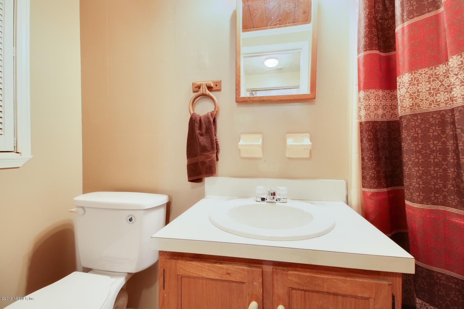 445 Sigsbee Road Orange Park, FL 32073 - Photo 11 of 32 a bathroom with a sink and a toilet