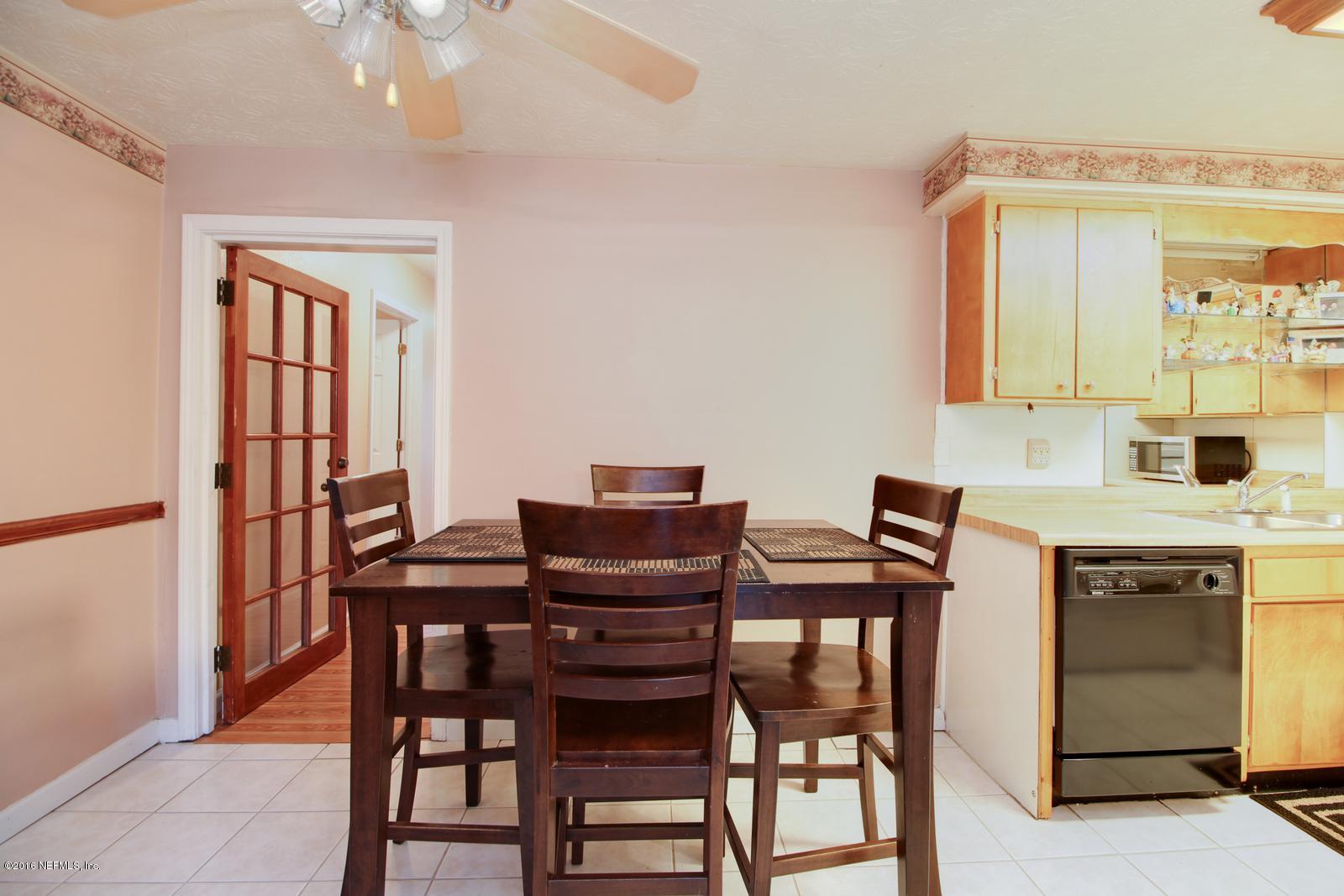 445 Sigsbee Road Orange Park, FL 32073 - Photo 7 of 32 a view of a dining room with furniture and window