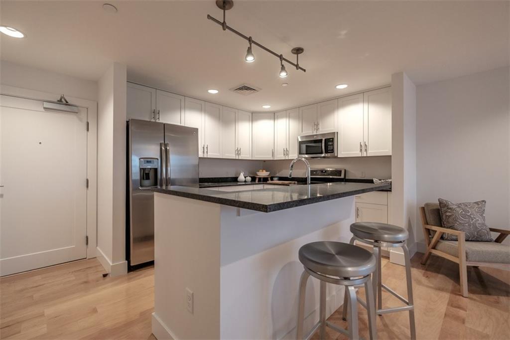 25 High Street, Unit 514 Portland, ME 04101 - Photo 6 of 29 Bar seating is great for entertaining