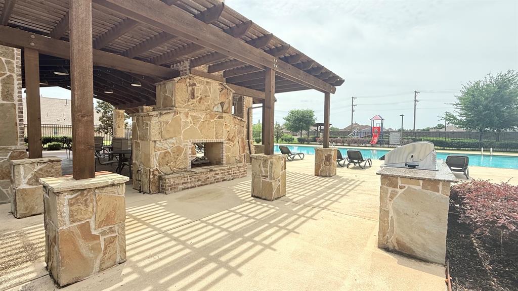 337 Prairie Ridge Lane Lewisville, TX 75056 - Photo 26 of 28 a view of a patio with dining table and chairs