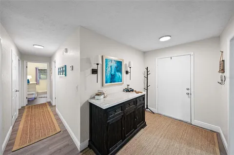 a bedroom with a bed and a television