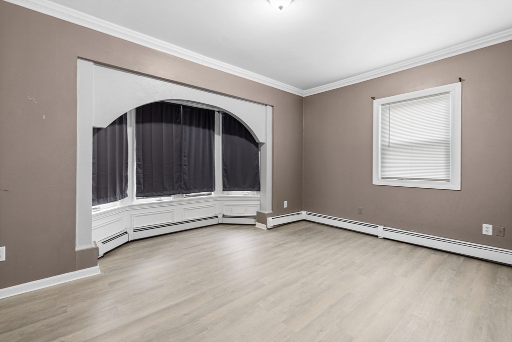 640 South Main Street Fall River, MA 02721 - Photo 11 of 33 a view of an empty room with wooden floor and a window