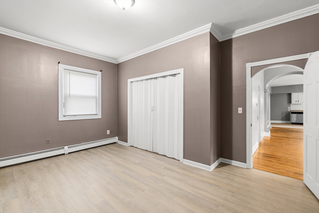 640 South Main Street Fall River, MA 02721 - Photo 12 of 33 a view of an empty room with window and a kitchen