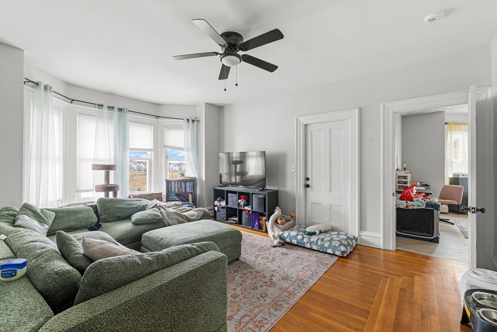 640 South Main Street Fall River, MA 02721 - Photo 17 of 33 a living room with furniture and a flat screen tv
