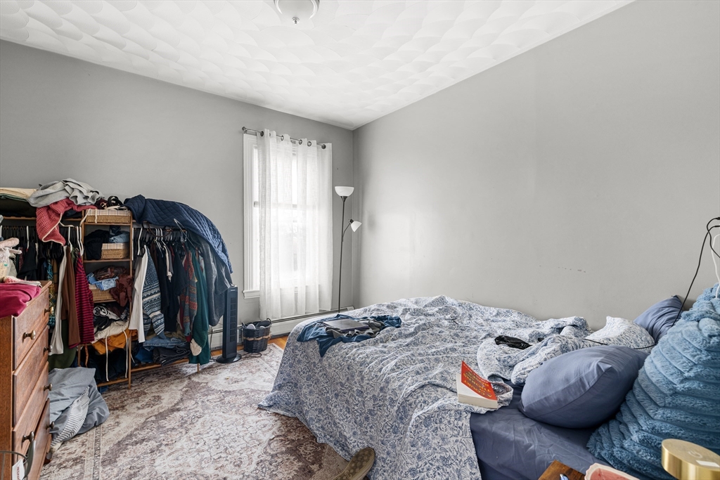 640 South Main Street Fall River, MA 02721 - Photo 21 of 33 a bedroom with bed and a closet
