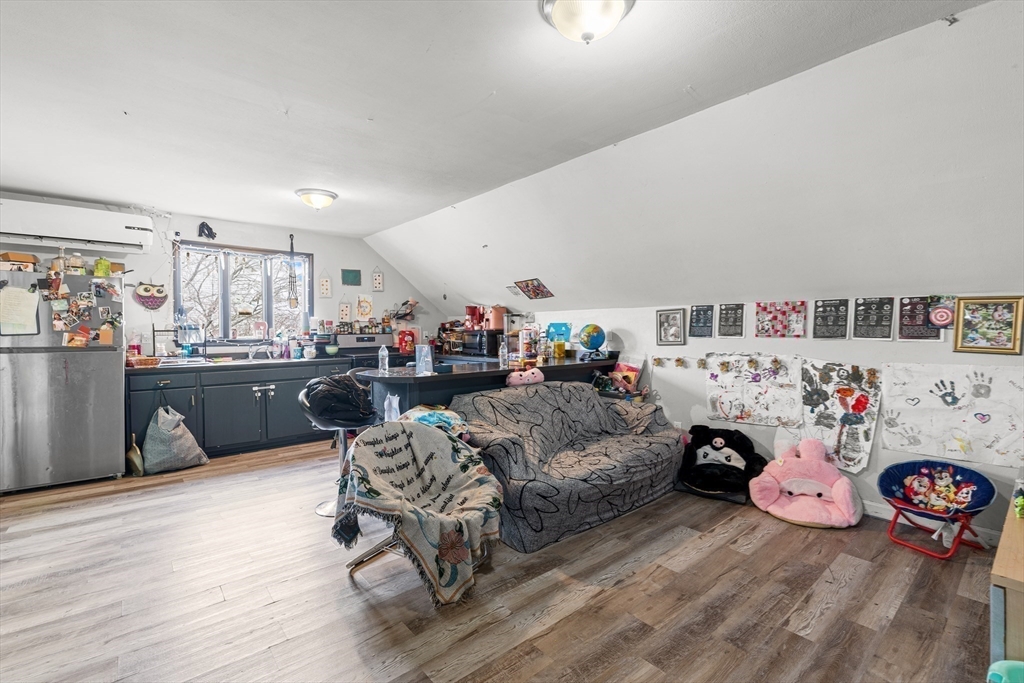 640 South Main Street Fall River, MA 02721 - Photo 25 of 33 a living room with furniture and a wooden floor
