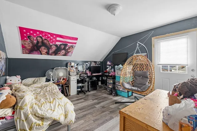 a room with furniture a rug and gym equipment