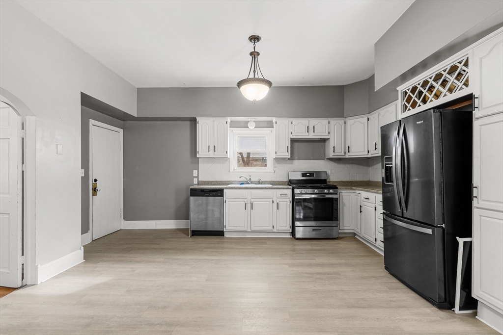 640 South Main Street Fall River, MA 02721 - Photo 4 of 33 a kitchen with stainless steel appliances granite countertop a refrigerator a stove a sink and dishwasher