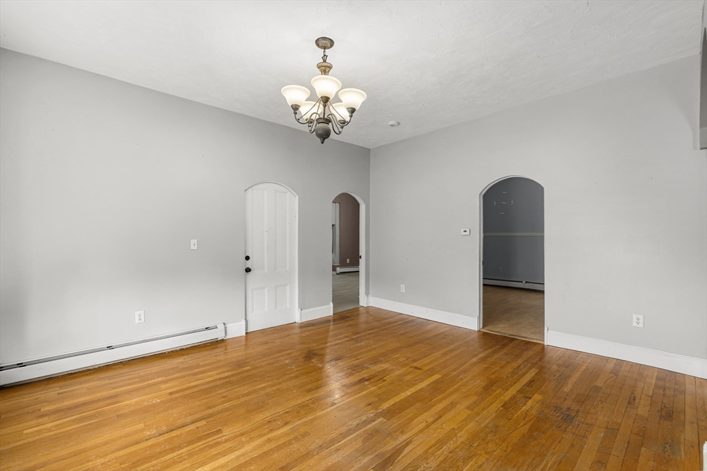 640 South Main Street Fall River, MA 02721 - Photo 9 of 33 a view of a room with wooden floor and chandelier