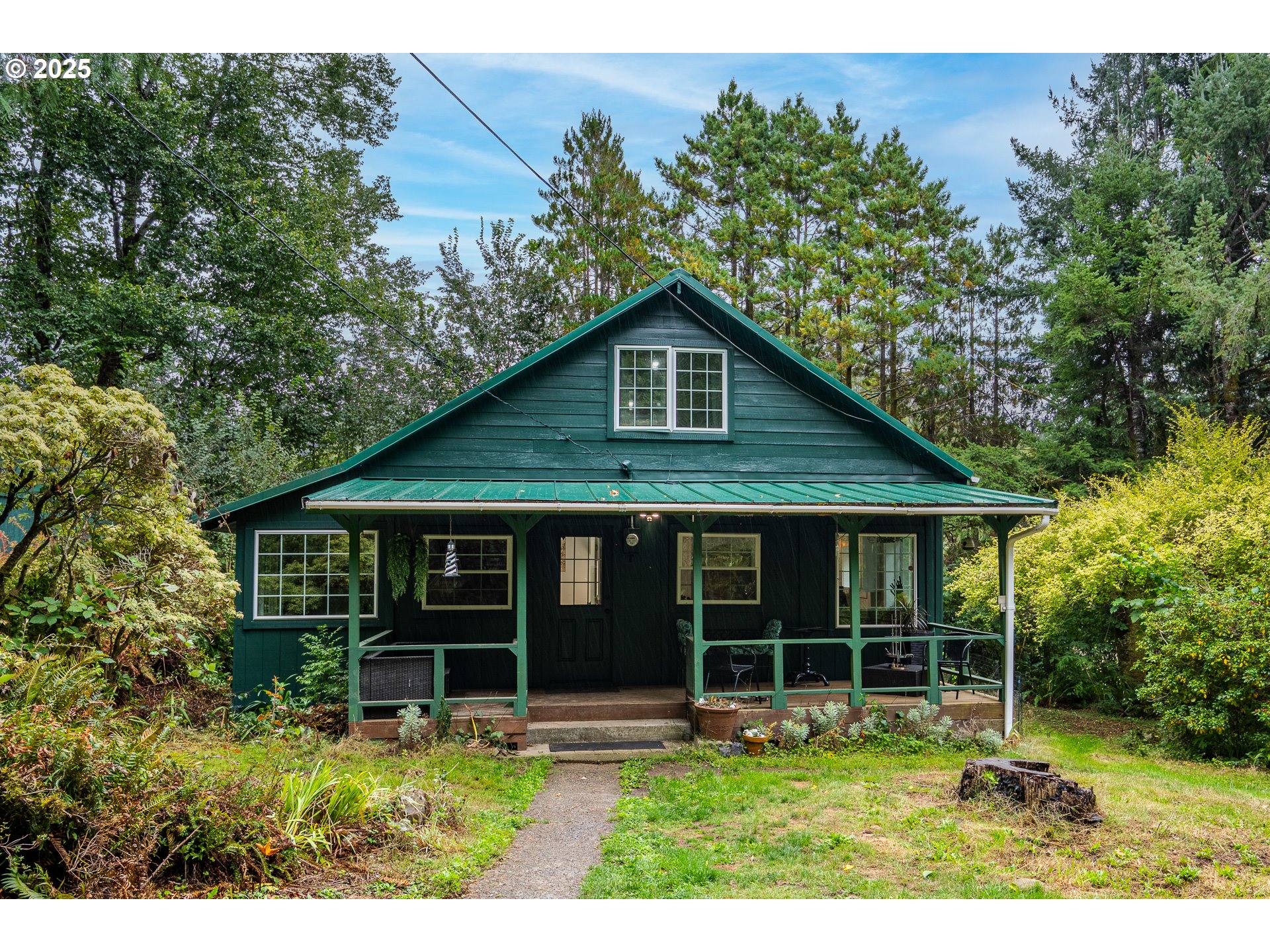 29 Neal Loop Toledo, OR 97391 - Photo 1 of 45 a view of a house with a yard potted plants and large tree