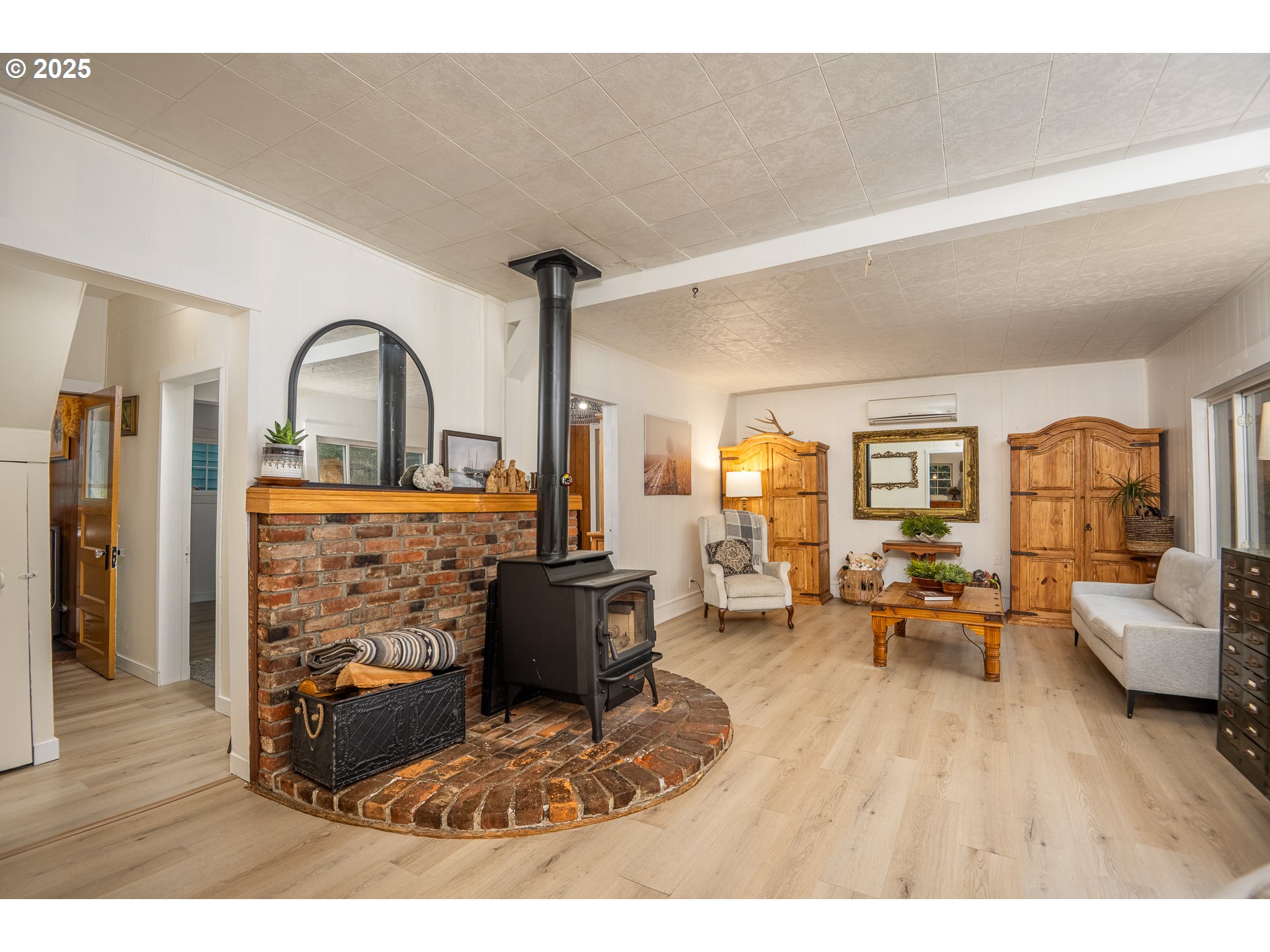 29 Neal Loop Toledo, OR 97391 - Photo 14 of 45 a living room with furniture a fireplace and wooden floor