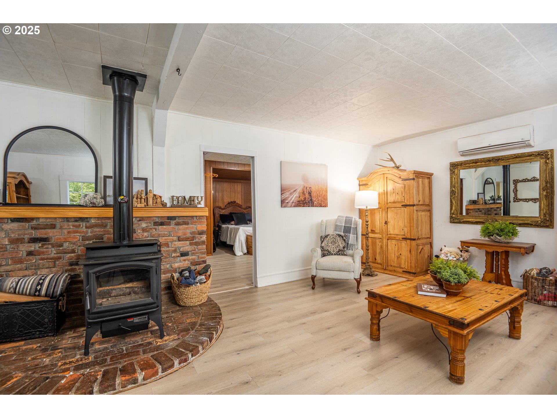 29 Neal Loop Toledo, OR 97391 - Photo 15 of 45 a living room with furniture a table and wooden floor
