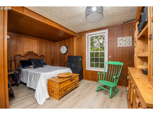 a bathroom with a sink a toilet a mirror and shower