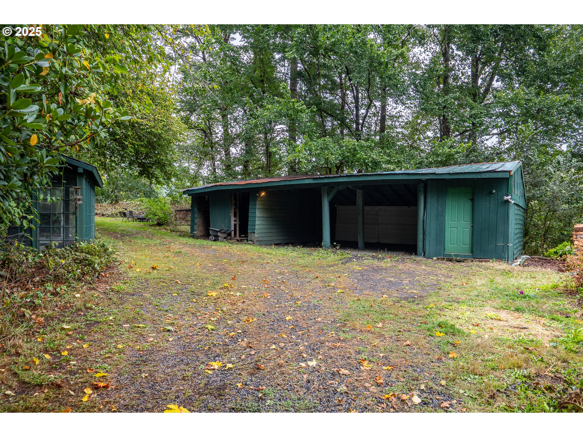 29 Neal Loop Toledo, OR 97391 - Photo 28 of 45 a view of a house with a yard and a garage