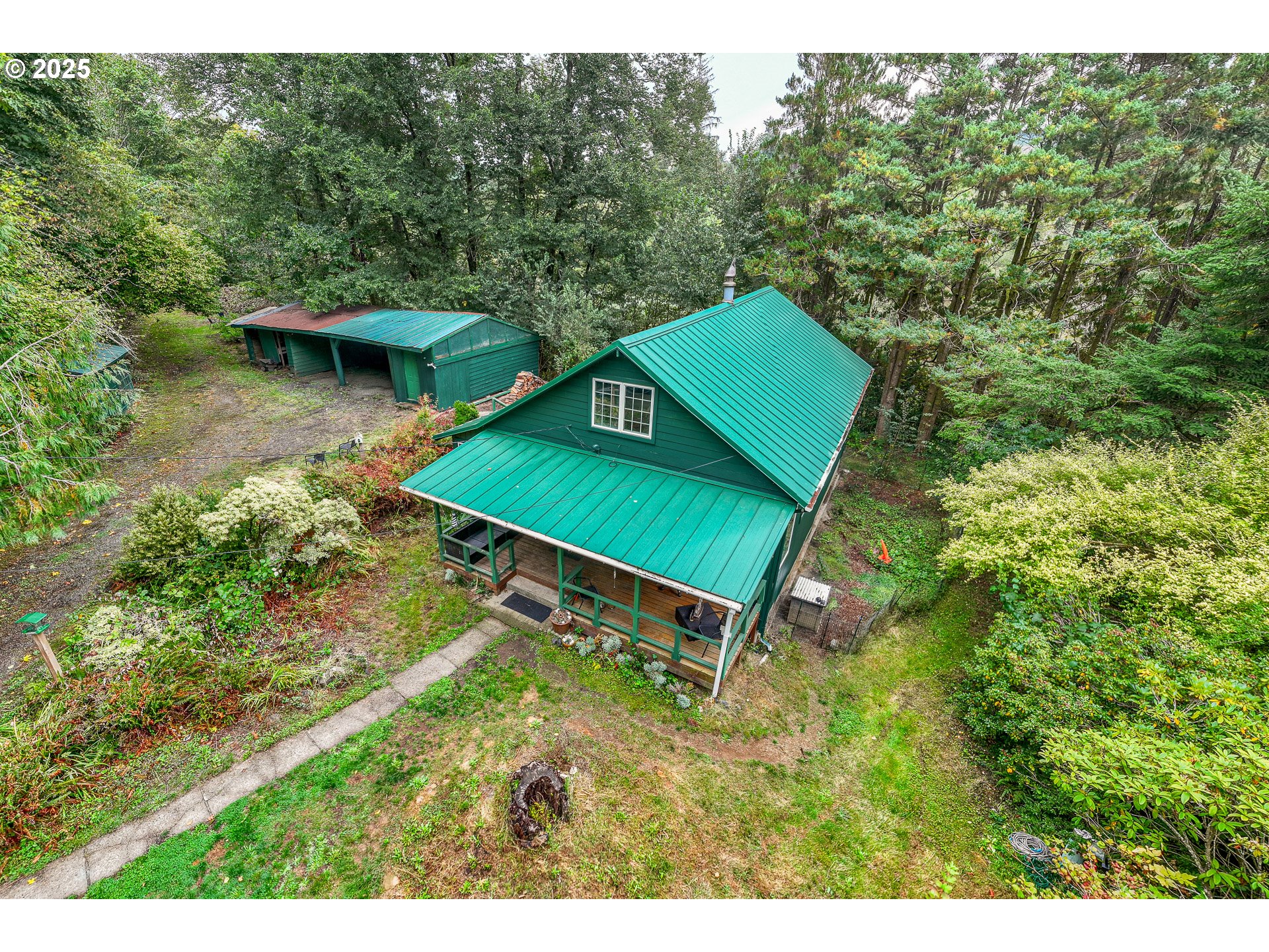 29 Neal Loop Toledo, OR 97391 - Photo 30 of 45 a view of a backyard with a patio