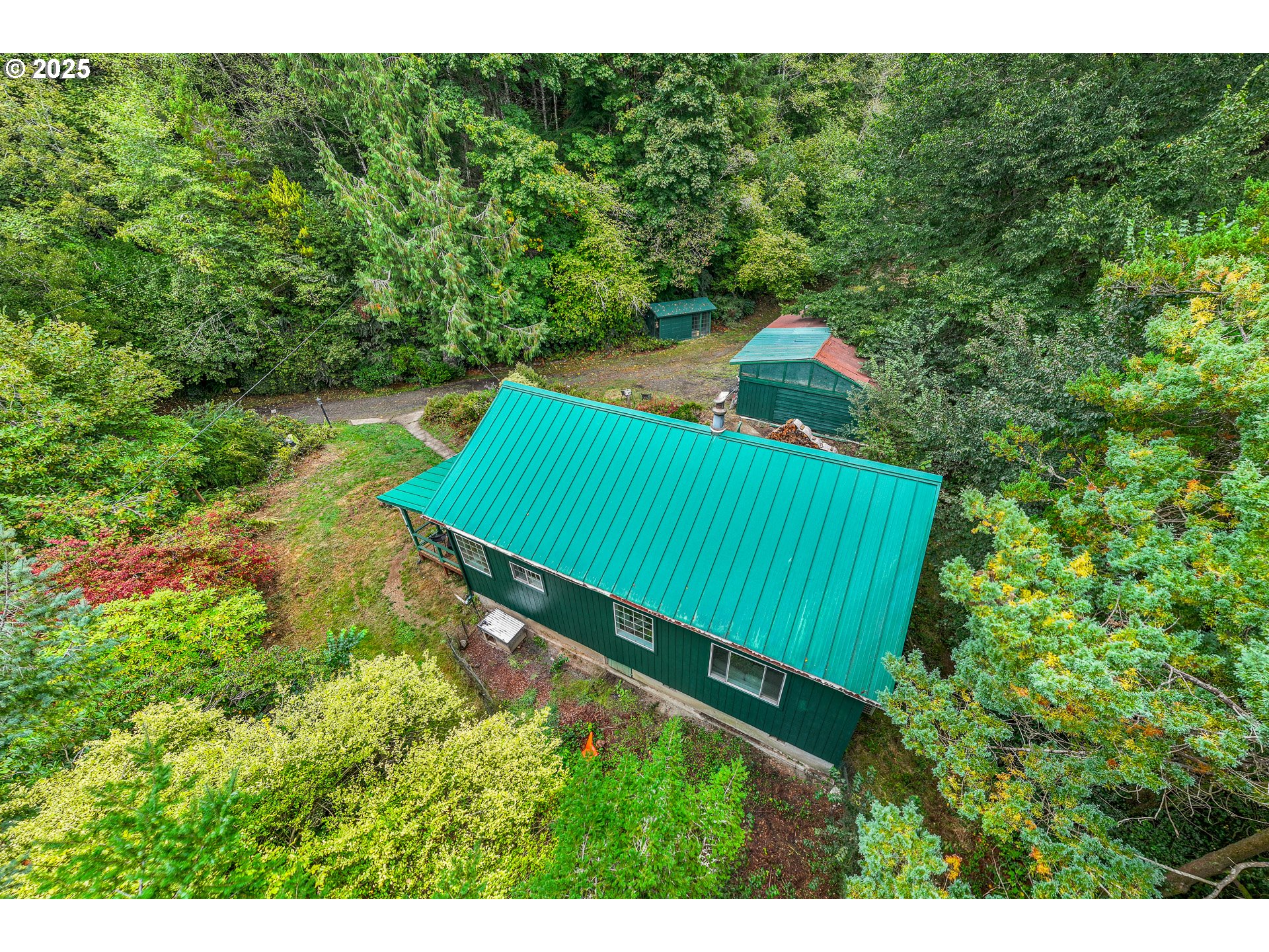 29 Neal Loop Toledo, OR 97391 - Photo 31 of 45 a green field with lots of trees