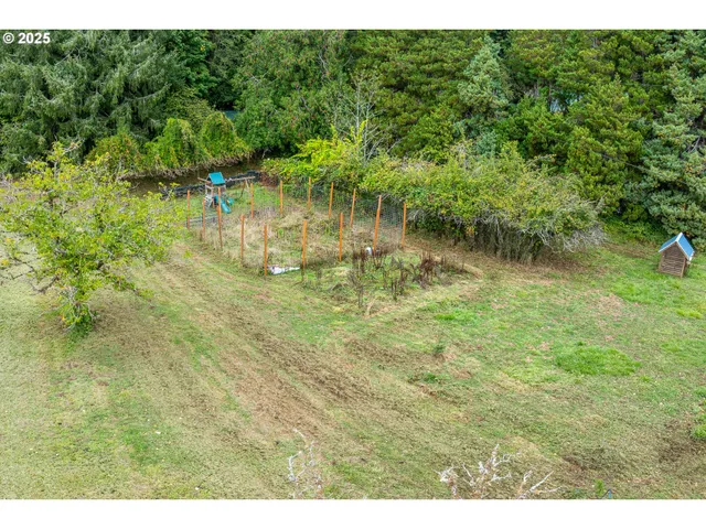 a aerial view of a house with a yard