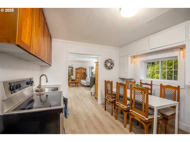 a view of a dining room with furniture window and outside view