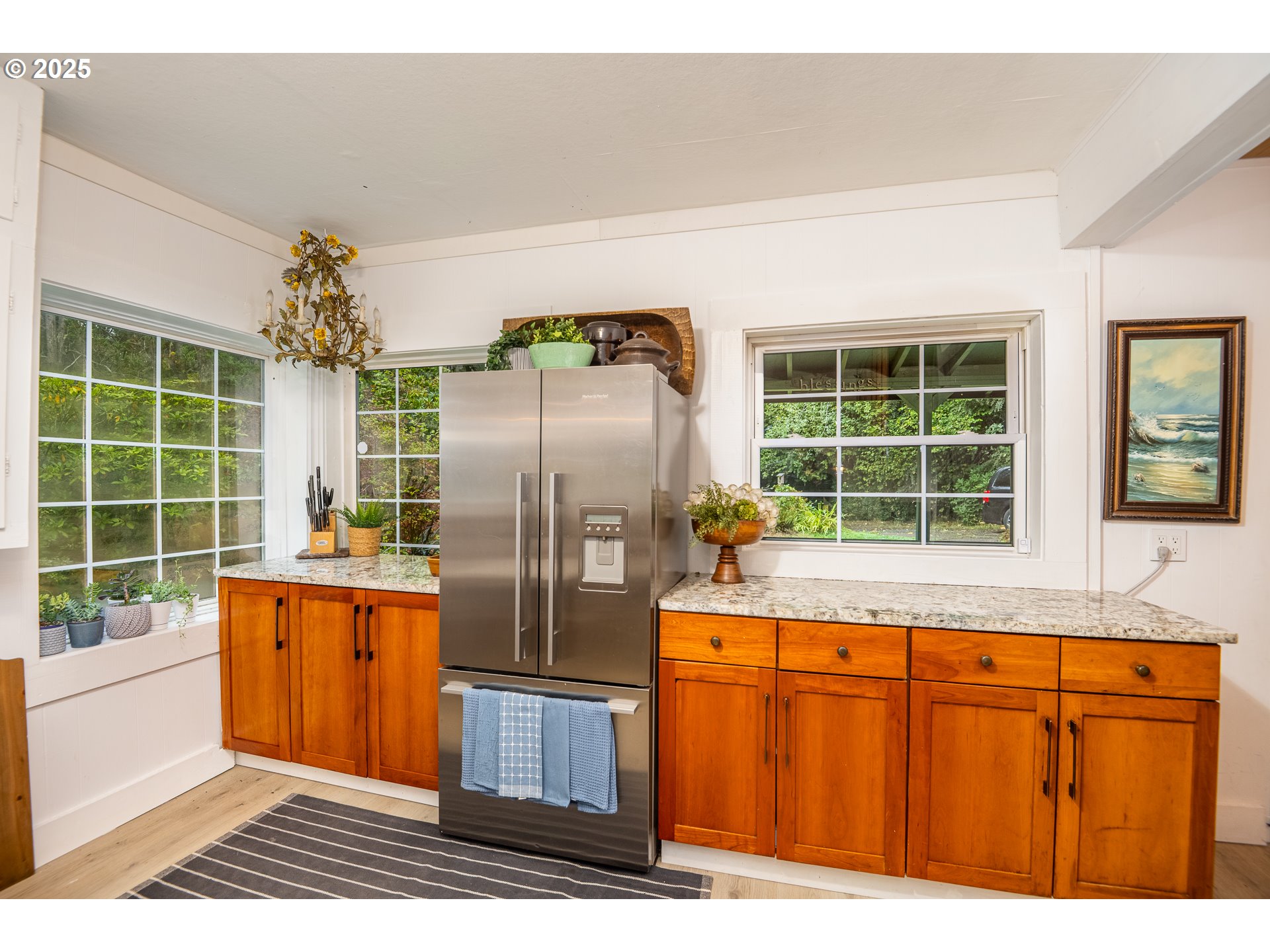 29 Neal Loop Toledo, OR 97391 - Photo 8 of 45 a kitchen with stainless steel appliances granite countertop a refrigerator and a sink