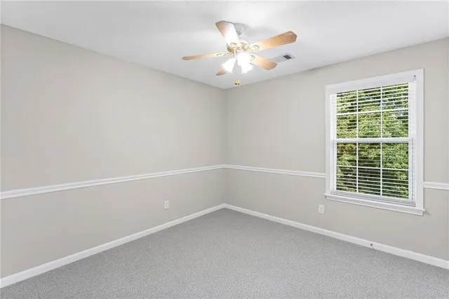 a bathroom with a sink toilet and mirror