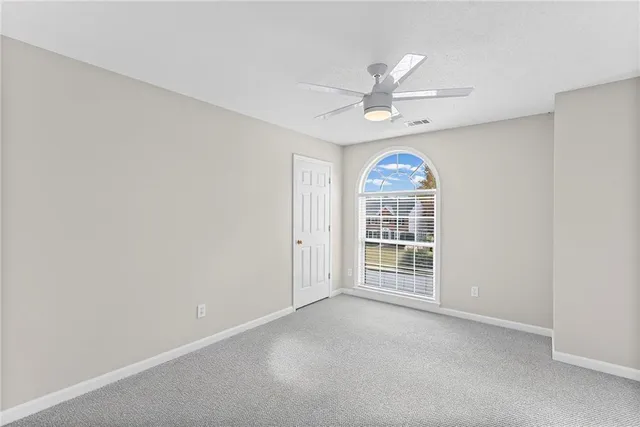 a front view of a house with a large window