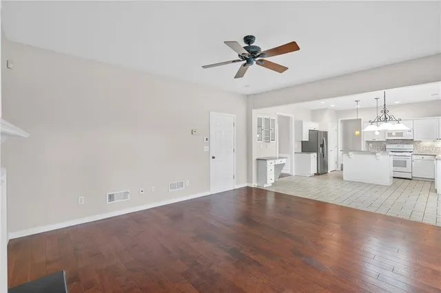 a view of a kitchen with a sink and a kitchen view