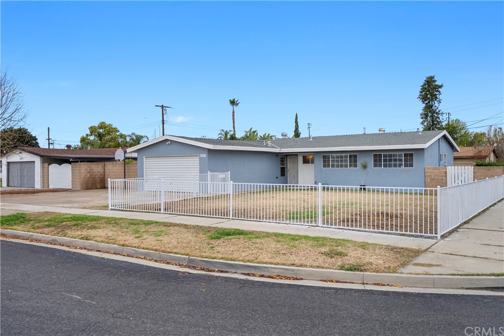 8531 Woodford Way Riverside, CA 92504 - Photo 1 of 1 front view of a house with a swimming pool