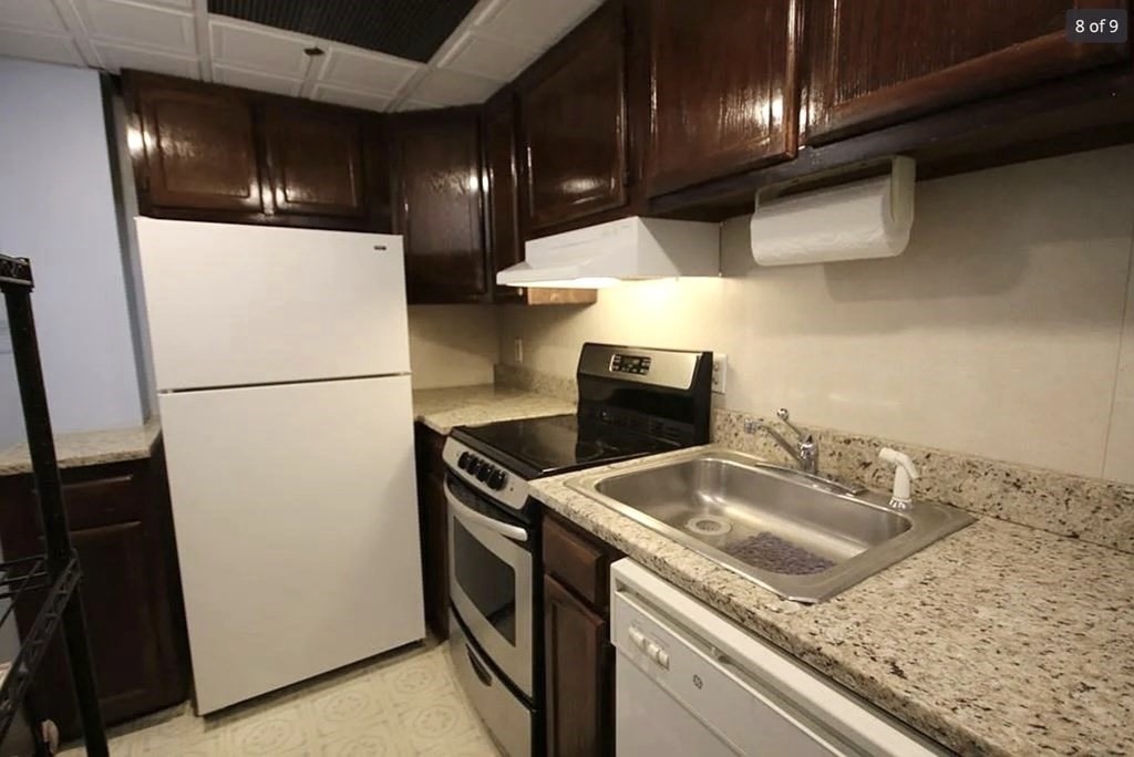 464 Commonwealth Avenue, Unit 72 Boston, MA 02215 - Photo 4 of 18 a kitchen with stainless steel appliances granite countertop a sink a refrigerator and a stove