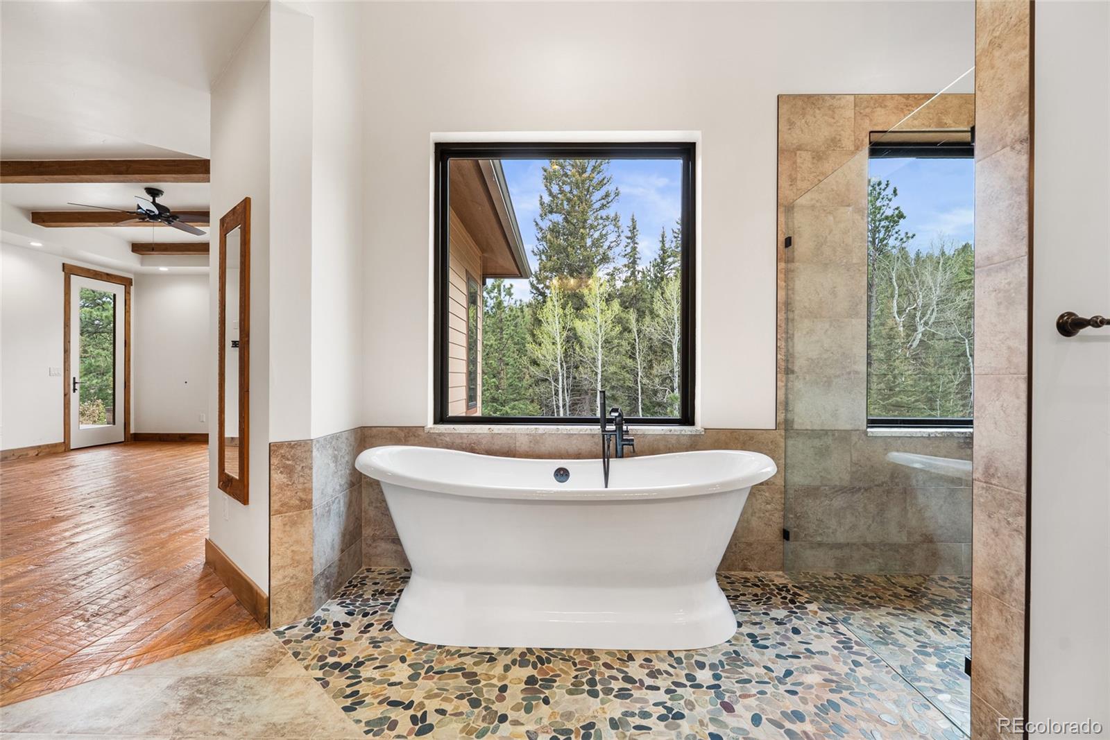 280 Double Tree Road Bailey, CO 80421 - Photo 31 of 43 a white bath tub sitting in a bathroom