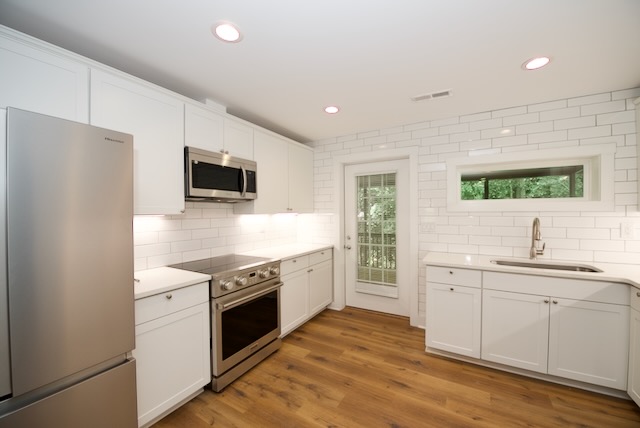 317 Pendleton Road Clemson, SC 29631 - Photo 14 of 36 A well-lit kitchen with sleek stainless steel appliances and abundant cabinetry awaits culinary adventures.