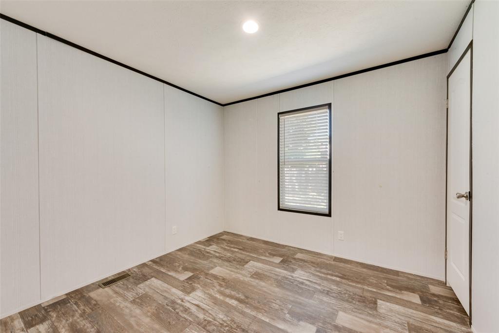 60 Tecumseh Road Valley View, TX 76272 - Photo 12 of 17 an empty room with windows