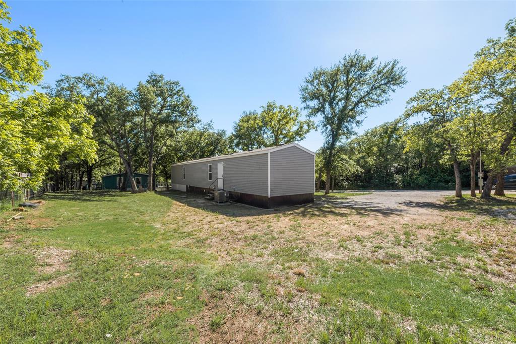 60 Tecumseh Road Valley View, TX 76272 - Photo 17 of 17 a backyard of a house with trees and entertaining space