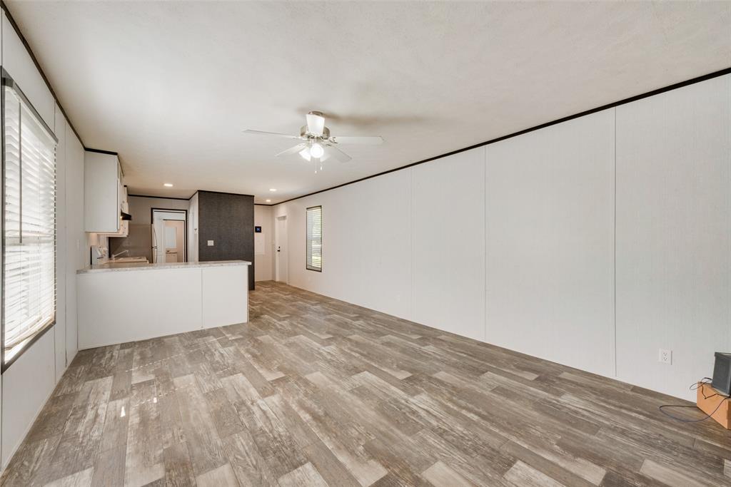 60 Tecumseh Road Valley View, TX 76272 - Photo 7 of 17 a view of a big room with windows and cabinet