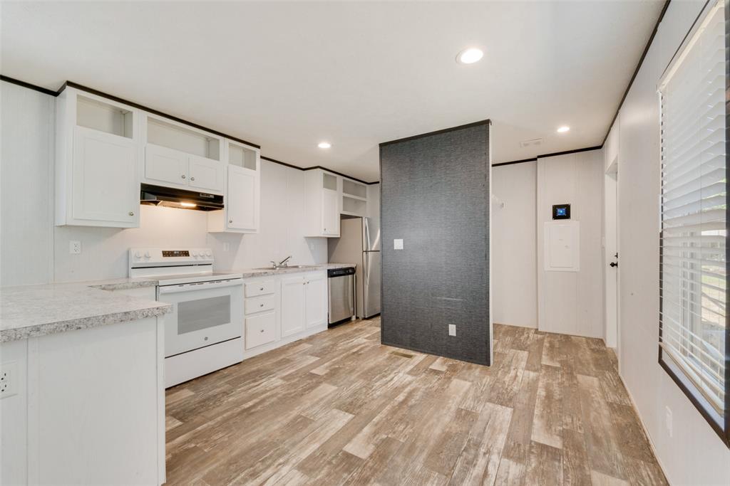60 Tecumseh Road Valley View, TX 76272 - Photo 8 of 17 a large white kitchen with a sink stainless steel appliances and cabinets