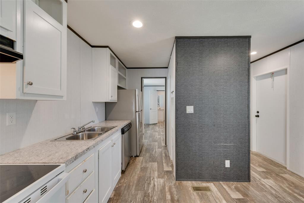 60 Tecumseh Road Valley View, TX 76272 - Photo 10 of 17 a kitchen with a sink and refrigerator